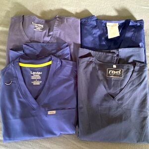 Navy blue scrub tops.  3/4 with tags.  I missed return windows 🤦‍♀️